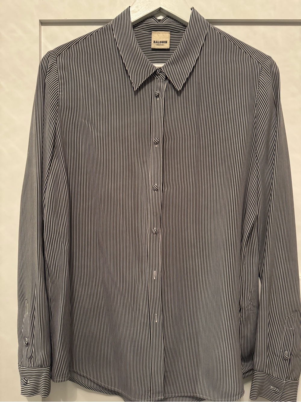 Baldwin women’s button down silk blouse. In navy and white pinstripes